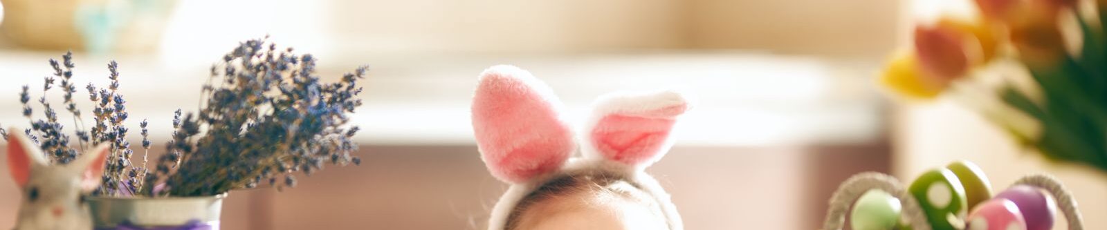 little girl wearing bunny ears for Easter